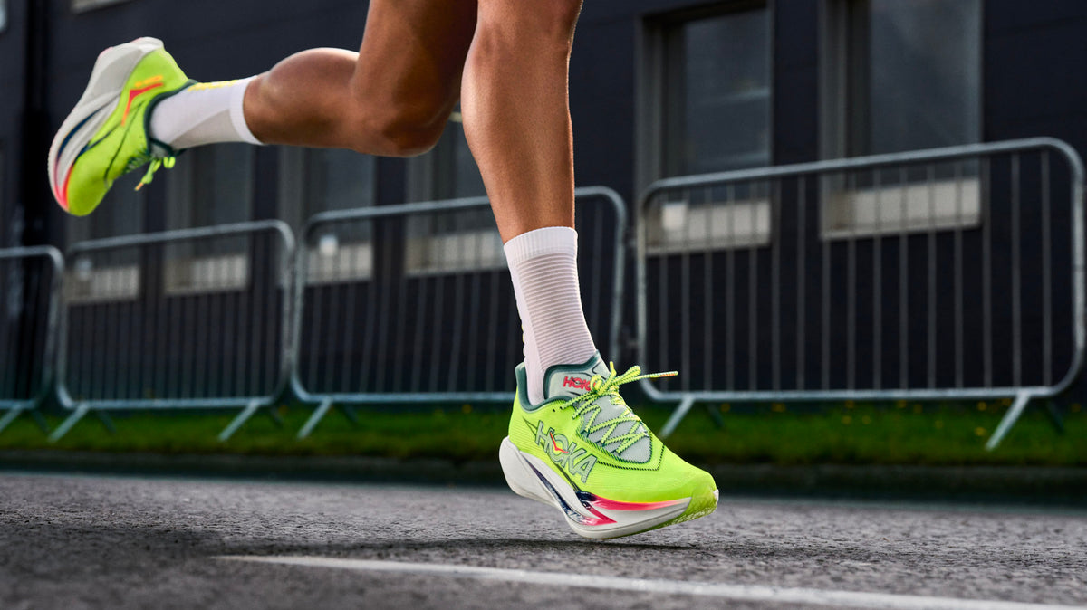 Runner lacing a shoe that shows a breathable mesh upper next to a knit and a film-overlay design for side-by-side comparison.
