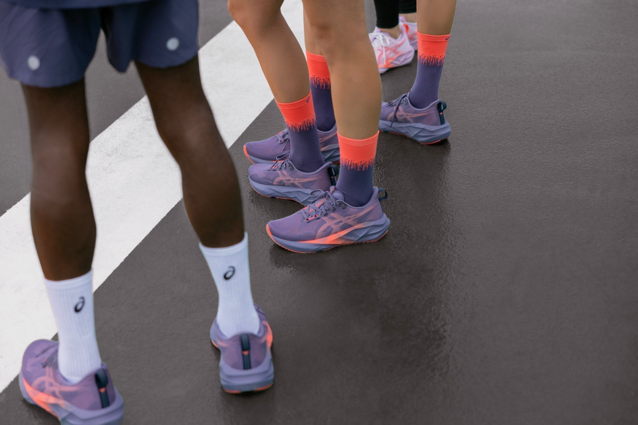 rear and side view of runners wearing Asics Superblast 2