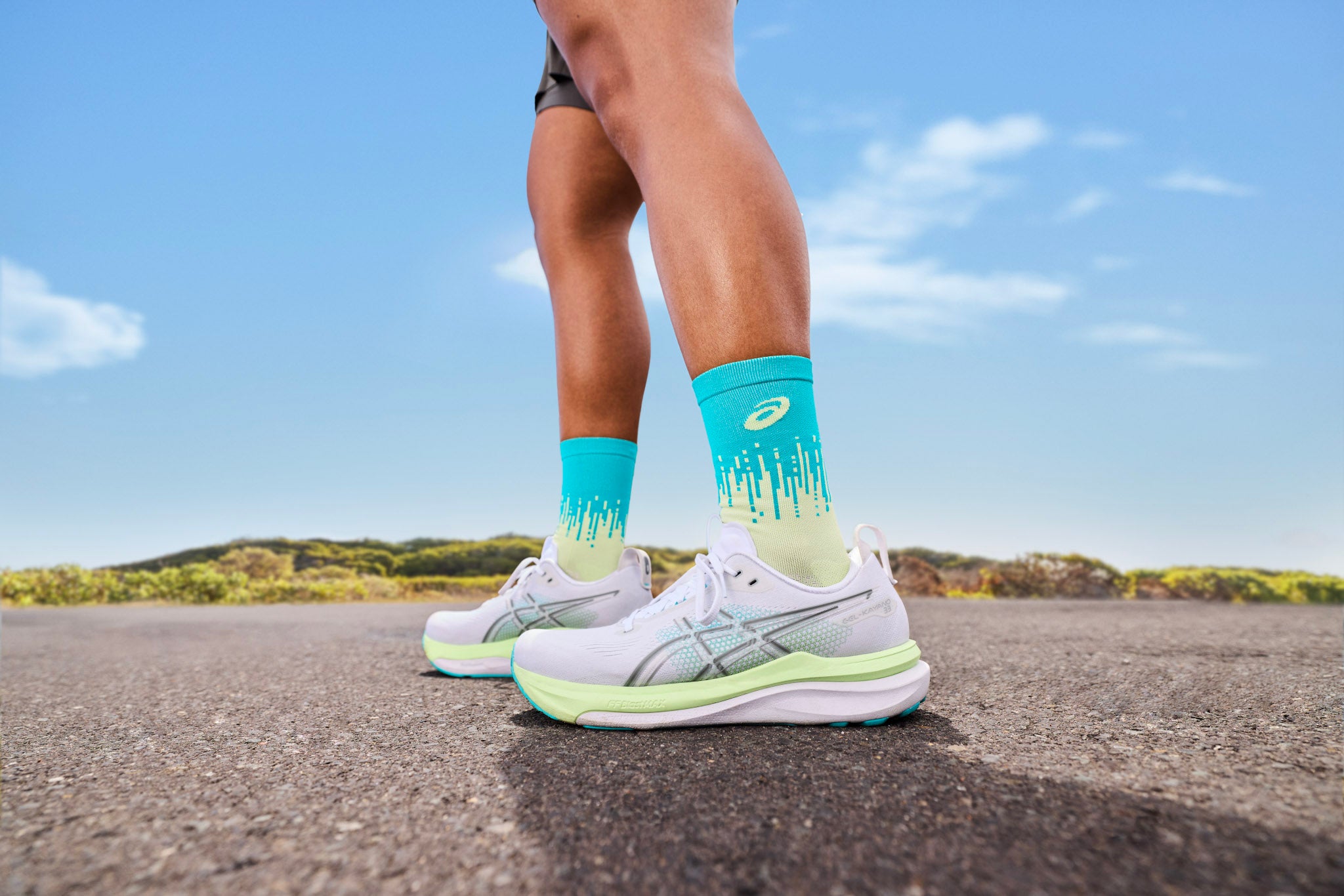 Neutral vs stability running shoes side-by-side on a bench, with callouts highlighting medial posting and sidewall rails.