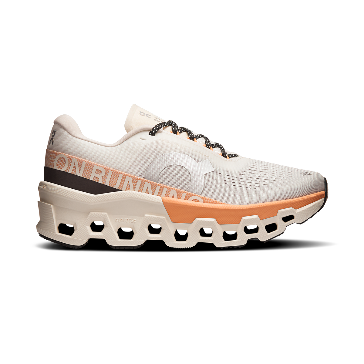 Women’s On Cloudmonster 2 in Ivory Tangerine, side view.