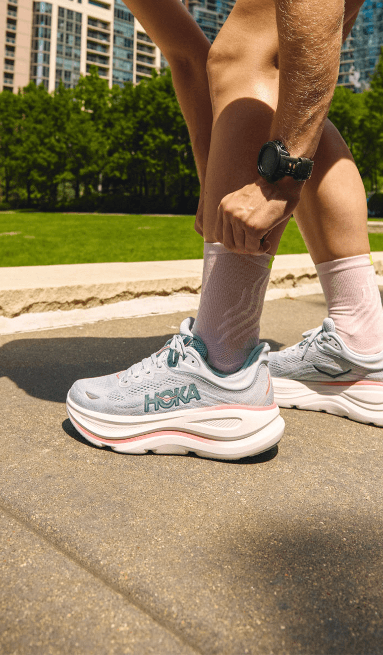 Floor angle of the HOKA Bondi 9 running shoe showing thick cushioned midsole and lightweight mesh upper