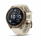 Garmin Fenix 9 Pro sportwatch in Autumn Gold Titanium with Cream/French Gray band, angled front view