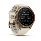 Garmin Fenix 9 Pro sportwatch in Autumn Gold Titanium with Cream/French Gray band, angled view with activity summary
