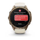 Garmin Fenix 9 Pro sportwatch in Autumn Gold Titanium with Cream/French Gray band, front view with emergency response feature