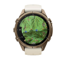 Garmin Fenix 9 Pro sportwatch in Autumn Gold Titanium with Cream/French Gray band, front view with topographic map
