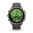 Garmin fēnix 9 Pro smartwatch in Titanium with Graphite/Black band, front view with topographic map